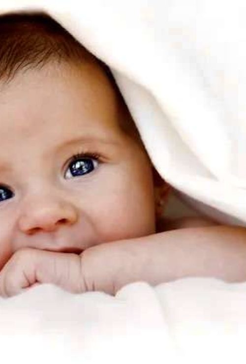 depositphotos_12302401-stock-photo-baby-under-blanket
